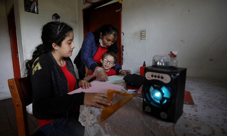 Image IconFanny Mendez, right, mother of 14-year-old Marlene Beltran, left, and Felipe Beltrán, 5, h