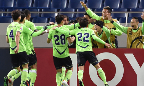 In this file photo taken on April 9, 2019, players from Jeonbuk Hyundai Motors celebrate their goal 