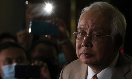 Former Malaysian Prime Minister Najib Razak looks on during a news conference outside Kuala Lumpur H