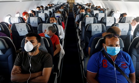 Passengers wearing protective face masks 