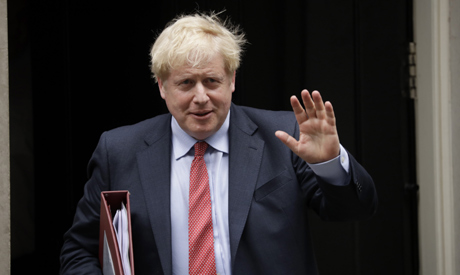 British Prime Minister Boris Johnson leaves number 10 Downing Street . (AP)