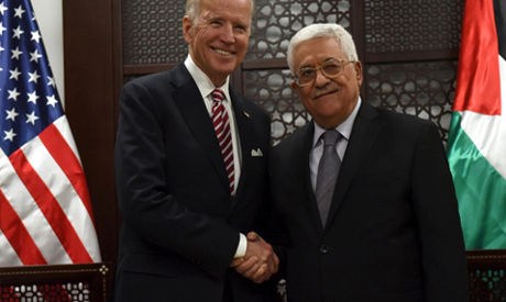 FILE PHOTO: U.S. Vice-President Joe Biden (L) shakes hands with Palestinian President Mahmoud Abbas 