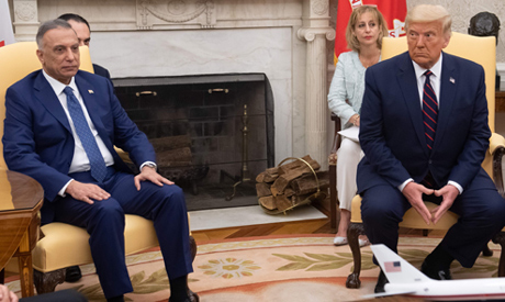 US President Donald Trump(R) meets with Iraqi Prime Minister Mustafa al-Kadhemi  in the Oval Office 