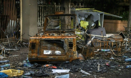 Remains of a burned-out car and building in the Oromia town, Ethiopia