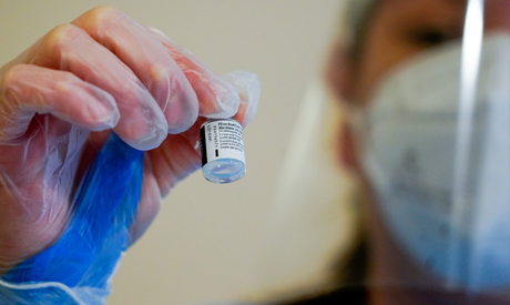 FILE PHOTO: An employee of the El Viso nursing home, Yadira Toral holds a vial of the Pfizer-BioNTec
