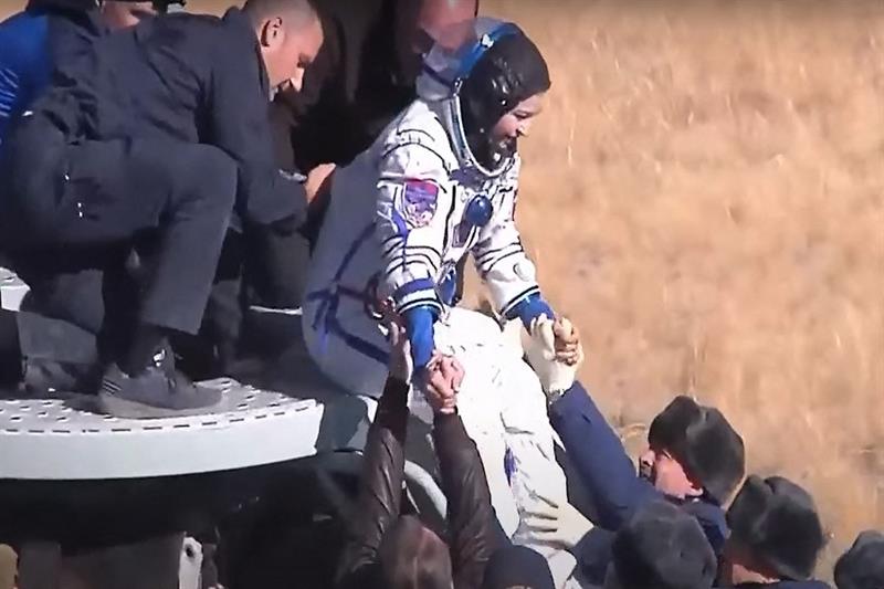 Actress, Yulia Peresild, is helped to disembark after the landing of the Russian Soyuz MS-18 