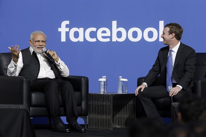 India s Prime Minister Narendra Modi, left, speaks next to Facebook CEO Mark Zuckerberg