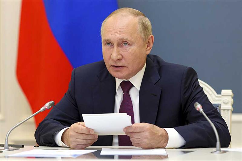 Russian President Vladimir Putin speaks as he attends the G20 summit via videoconference in Moscow, 