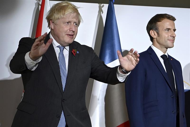British Prime Minister Boris Johnson, left, and French President Emmanuel Macron attend the G20 summ
