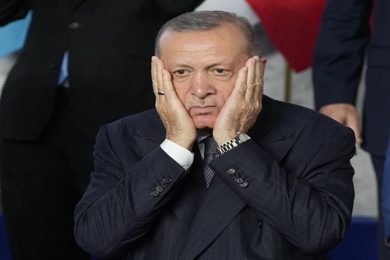 Turkey s President Recep Tayyip Erdogan reacts during a group photo of world leaders at the La Nuvol