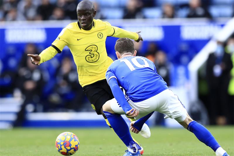 Chelsea s N Golo Kante, left, duels for the ball with Leicester s James Maddison during the English 