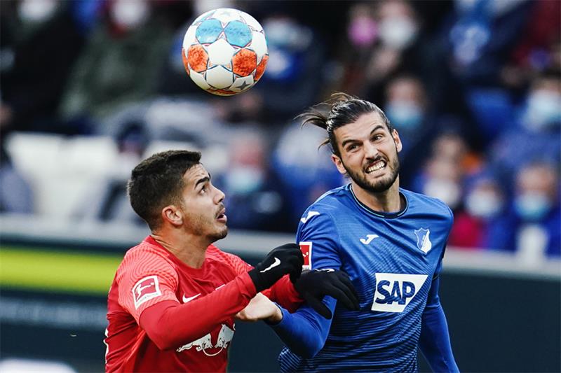 Leipzig s Andre Silva, left, and Hoffenheim s Florian Grillitsch fight for the ball during a German 