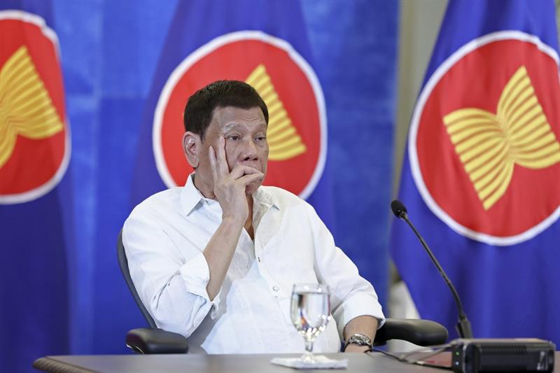 Philippine President Rodrigo Duterte listens during a virtual plenary session of the ASEAN-China Spe