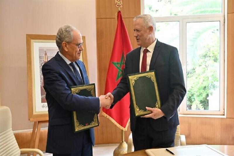 Defense Minister Benny Gantz, right, shakes hands with his Moroccan counterpart Abdellatif Loudiyi.