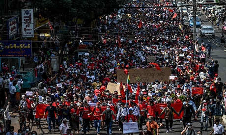 Protesters march during a demonstration against the military coup in Yangon