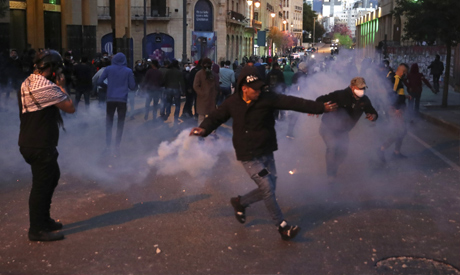 Riot police fire tear gas against anti-government protesters, during a protest near Parliament Squar
