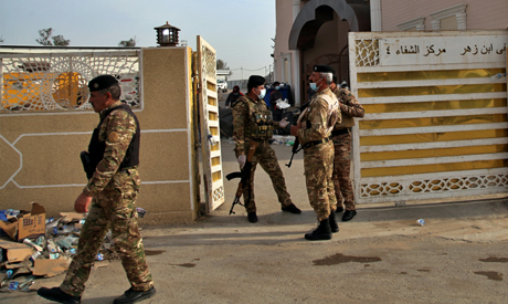 Security forces close the Ibn Al-Khatib hospital to investigate a fire that broke out overnight, in 