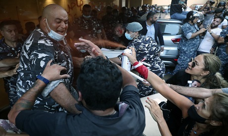 Lebanese police clash with protesters . AP