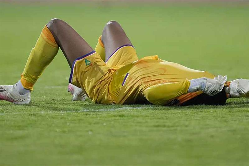 Comoros  goalkeeper Salim Ben Boina covers his face at the end of the African Cup of Nations 2022 gr