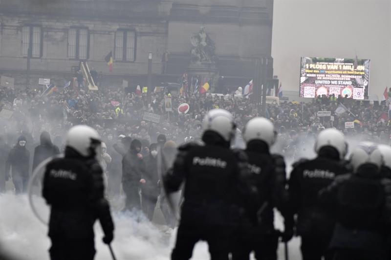 Police set off a water cannon against protesters in Brussels