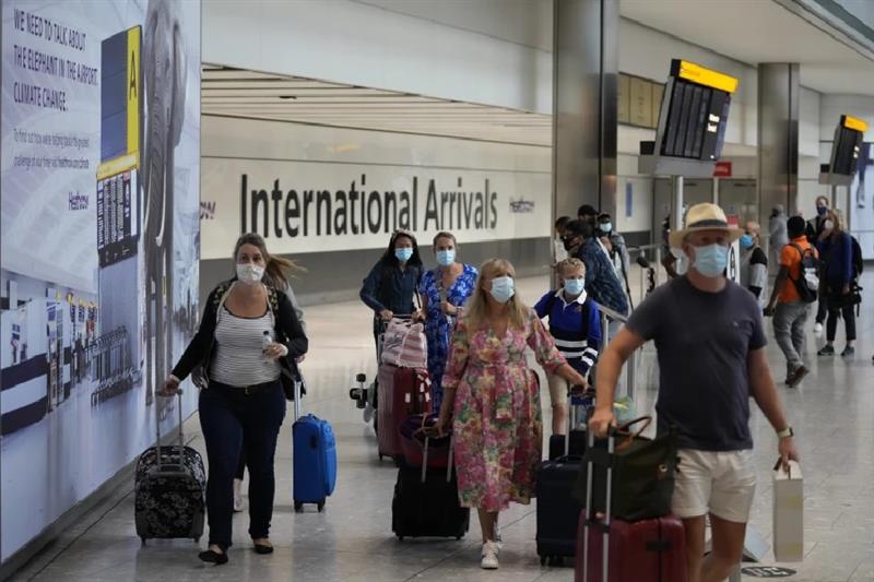 Passengers arrive at Heathrow Airport in London