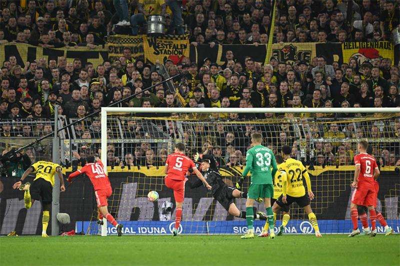 Dortmund s French forward Anthony Modeste (L) scores the 2-2 during the German first division Bundes