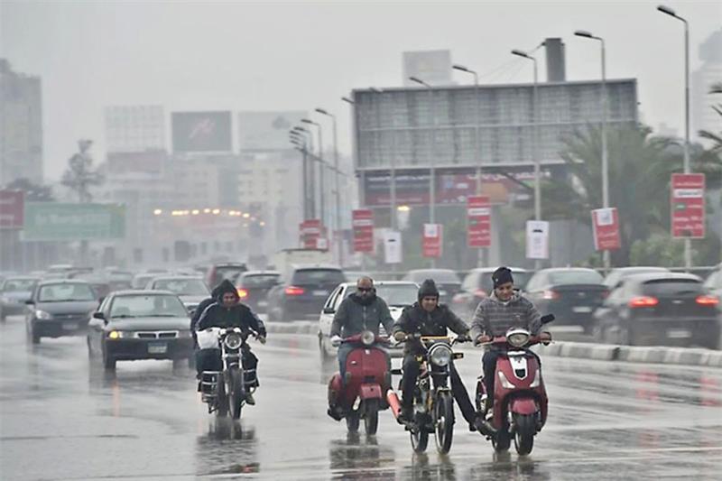 File Photo: People driving in the rain in Cairo. AFP