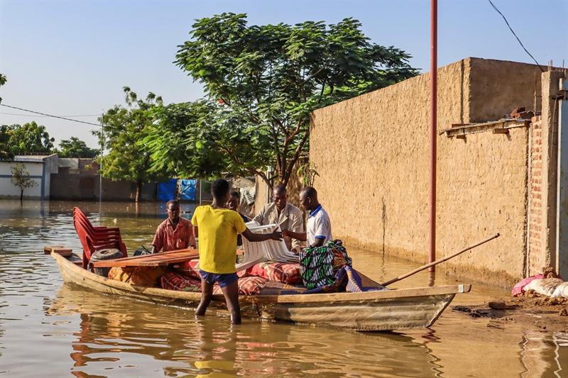Residents try to salvage items from houses submerged by floods in N Djamena, Chad 