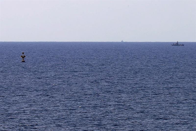 An Israeli military boat patrolling Mediterranean waters around a border-marking buoy between the tw