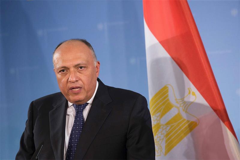 Egyptian Foreign Minister Sameh Shokry listens to his Russian counterpart during a joint press confe