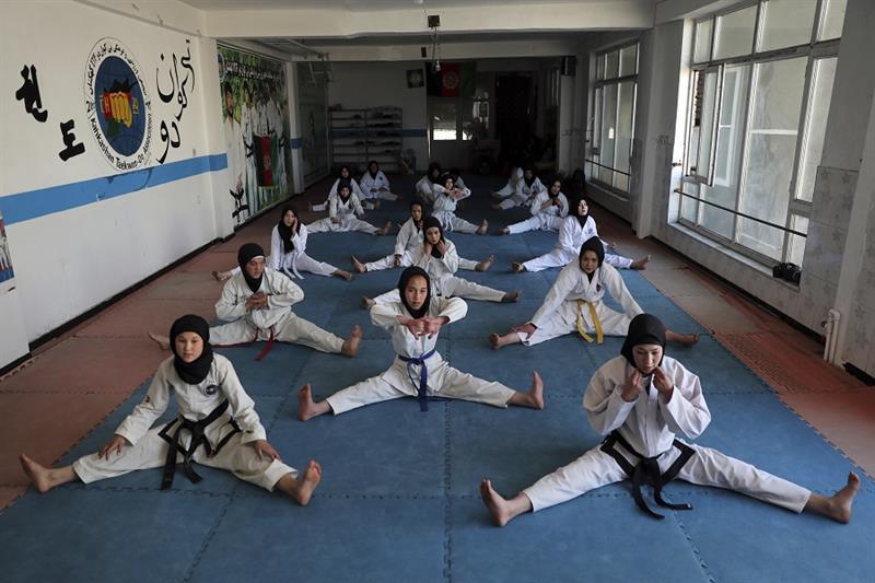 Female Afghan Taekwondo team members practice during a training session in Kabul, Afghanistan