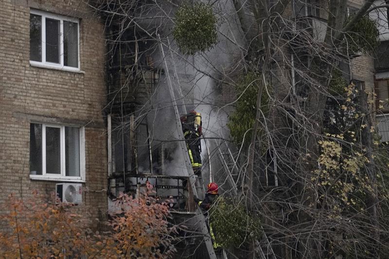 Ukrainian firefighters work to extinguish a fire 