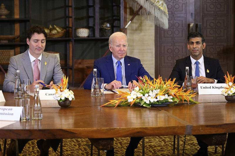 U.S. President Joe Biden, center, Canadian Prime Minister Justin Trudeau, left, and British Prime Mi