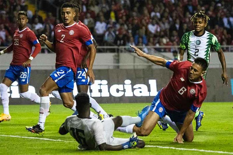 Costa Rica s Oscar Duarte (R) scores a goal against Nigeria during a friendly match at the National 