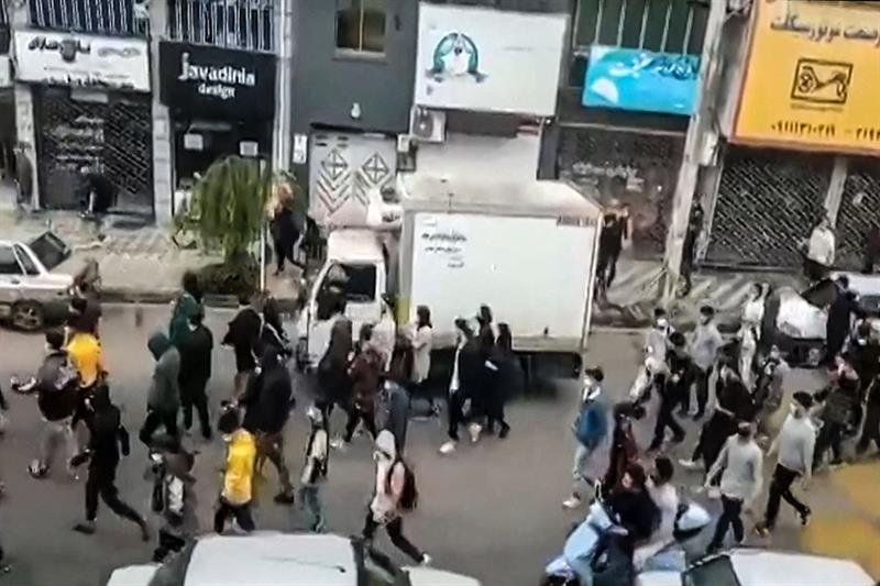 Iranian protesters marching through the streets of the city of Some-Sara, in the northern Gilan Prov