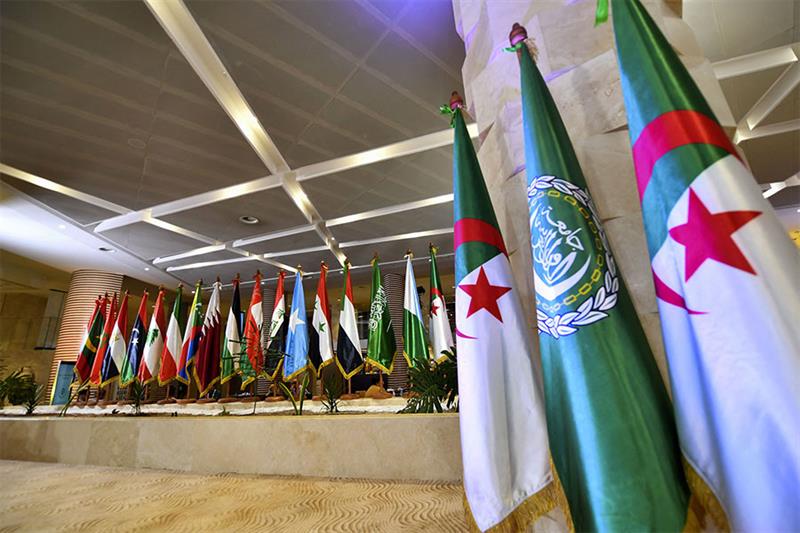 Flags of Arab League nations are set up at the convention center slated to host the league s Heads o