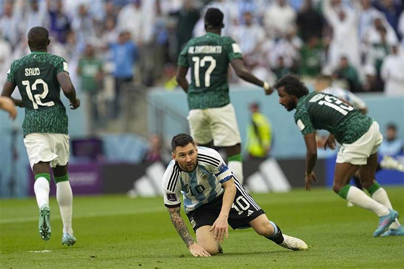 Argentina s Lionel Messi reacts after losing possession during the World Cup group C soccer match be