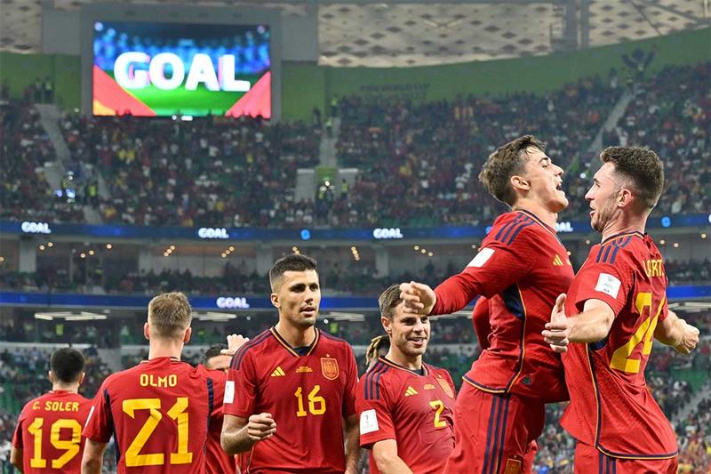 Spain s midfielder Gavi (2nd R) celebrates scoring his team s fifth goal during the Qatar 2022 World