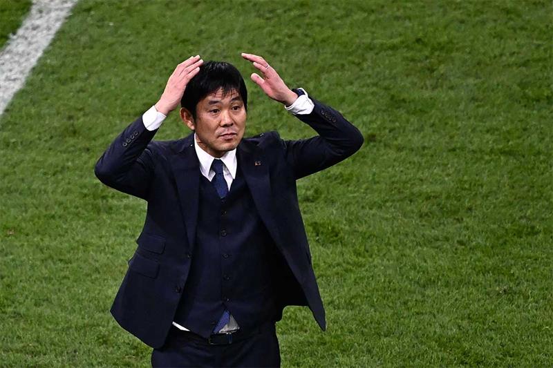 Japan s coach #00 Hajime Moriyasu celebrates his team s victory in the Qatar 2022 World Cup Group E 