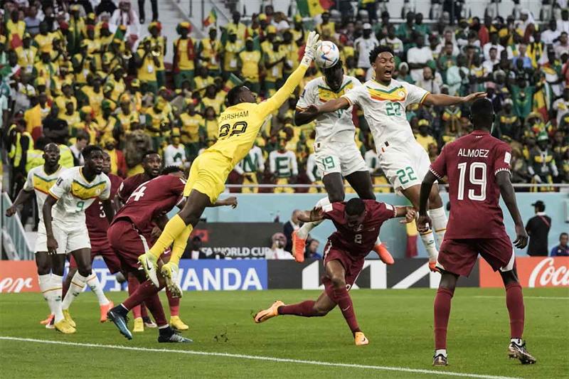 Qatar s goalkeeper Meshaal Barsham stops a shot during the World Cup group A soccer match between Qa