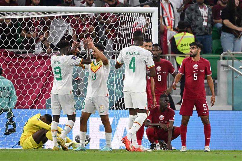 Players react after the final whistle of the Qatar 2022 World Cup Group A football match between Qat