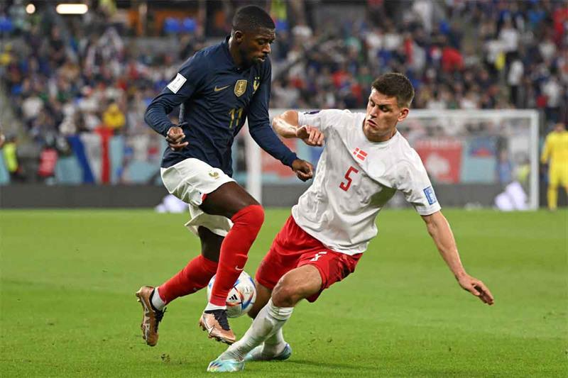 France s forward #11 Ousmane Dembele (L) fights for the ball with Denmark s defender #05 Joakim Maeh