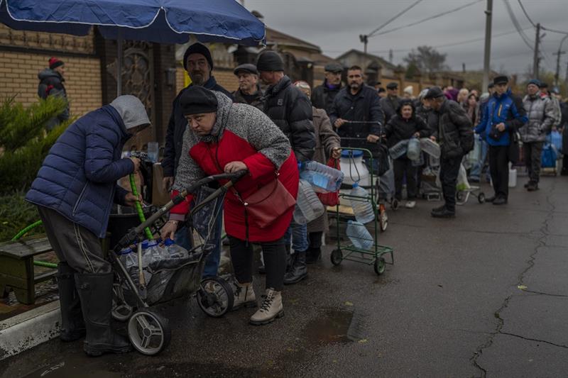 Residents queue to fill containers with drinking water in Kherson, southern Ukraine