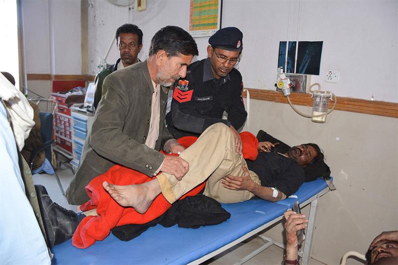 Injured policemen receive treatment at a hospital following a suicide bomb attack targeting a police