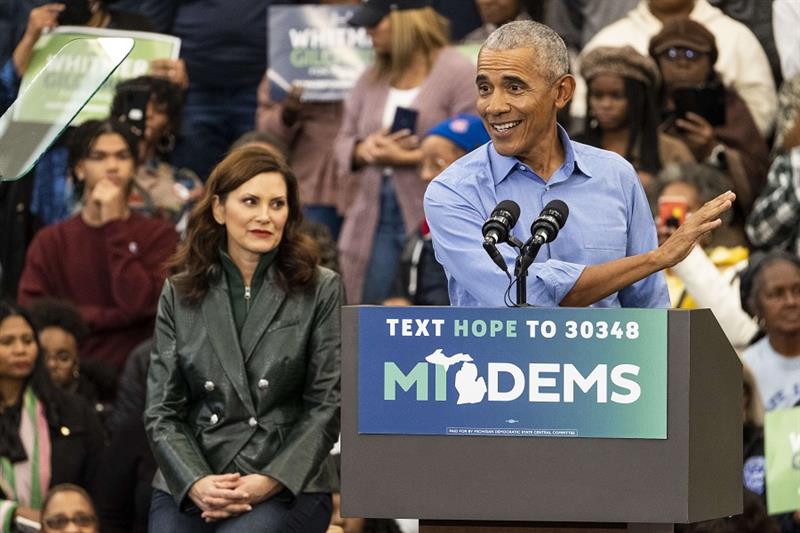 Former President Barack Obama speaks about to a crowd during a campaign rally for Michigan Democrats