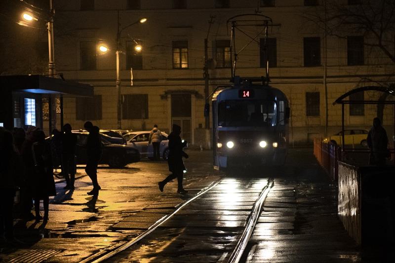 A tram arrives at a tram stop during a blackout in Kyiv, Ukraine