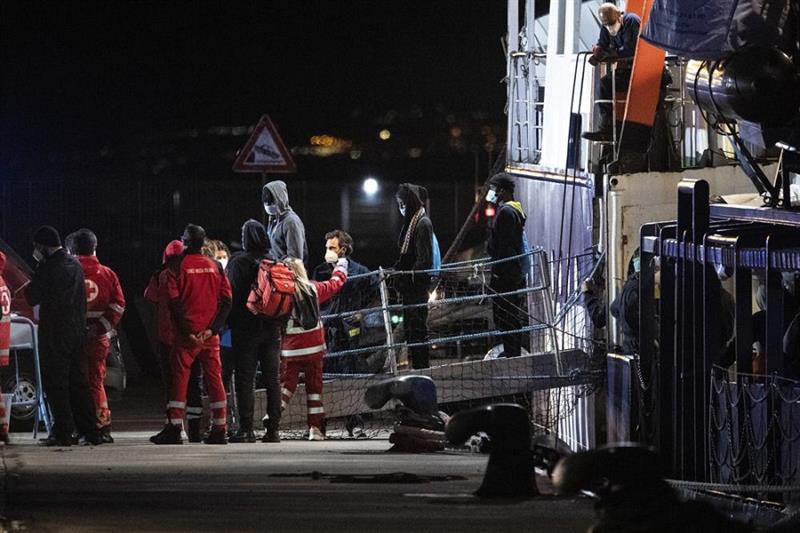Migrants disembark from the Humanity 1 rescue ship in Italy