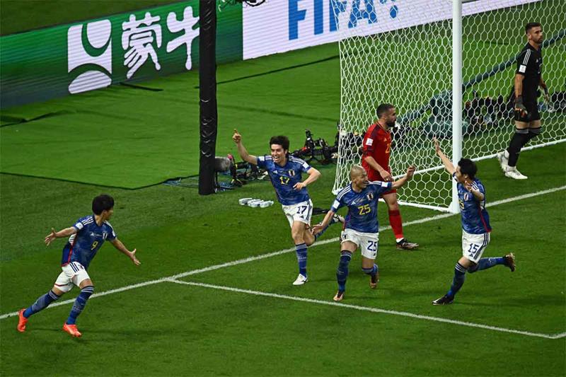 Japan beats Spain 2-1 as both teams advance at World Cup
