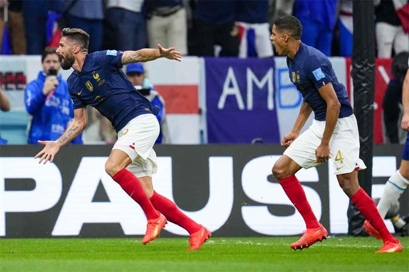 France s Olivier Giroud, left, reacts after scoring his team s second goal during the World Cup quar