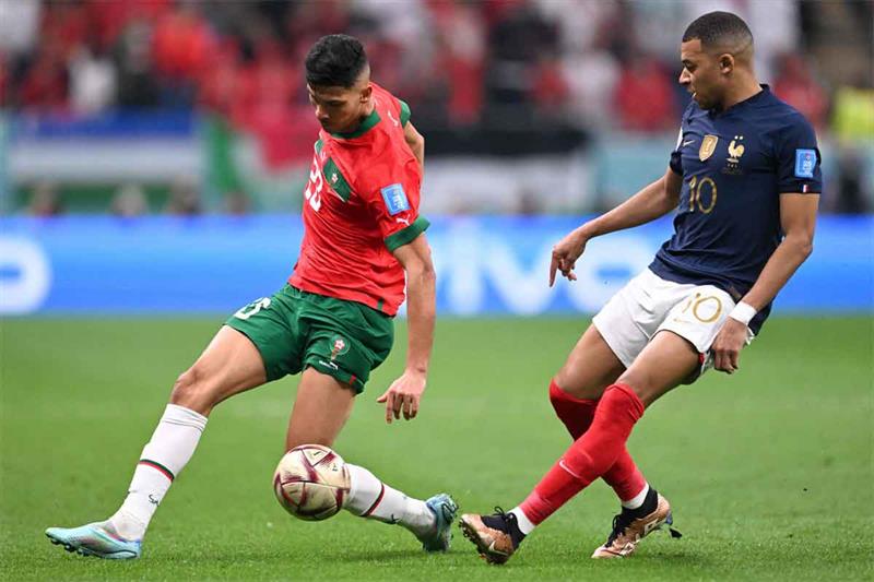 Morocco s defender #20 Achraf Dari fights for the ball with France s forward #10 Kylian Mbappe durin